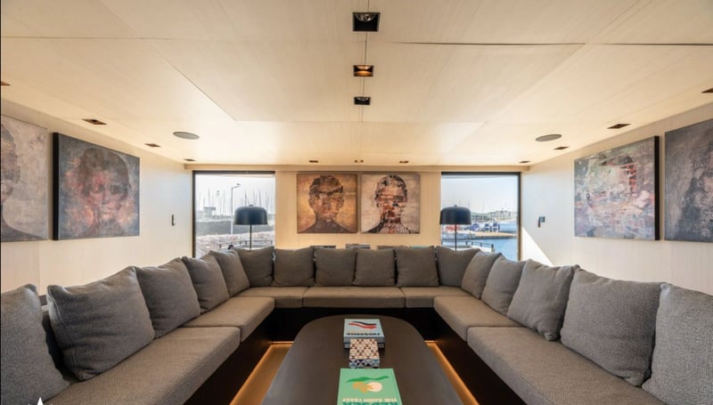 Main salon U-shaped sofa facing the aft windows