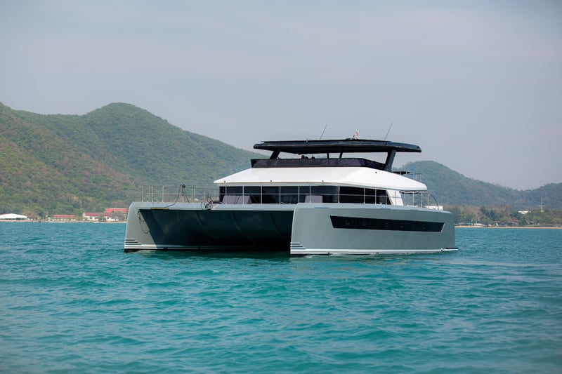 Side profile at sea. An 11m beam gives a stable, level ride.