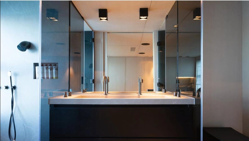 Owner's bathroom with double vanity and walk-in shower