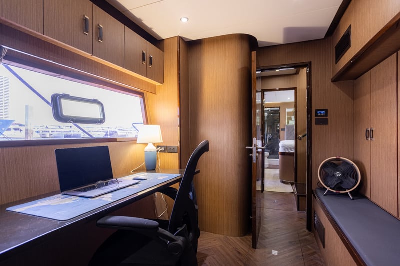 Quiet desk corner for working on board, with sea views from the chair.