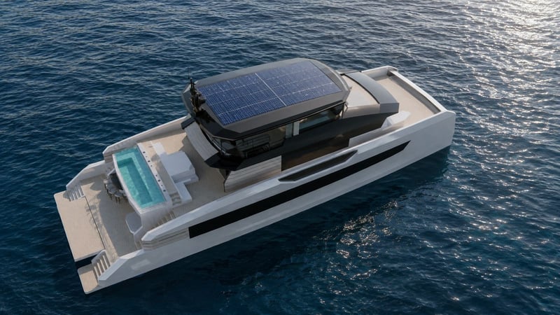 High aerial view showing the solar roof, aft pool and broad catamaran platform
