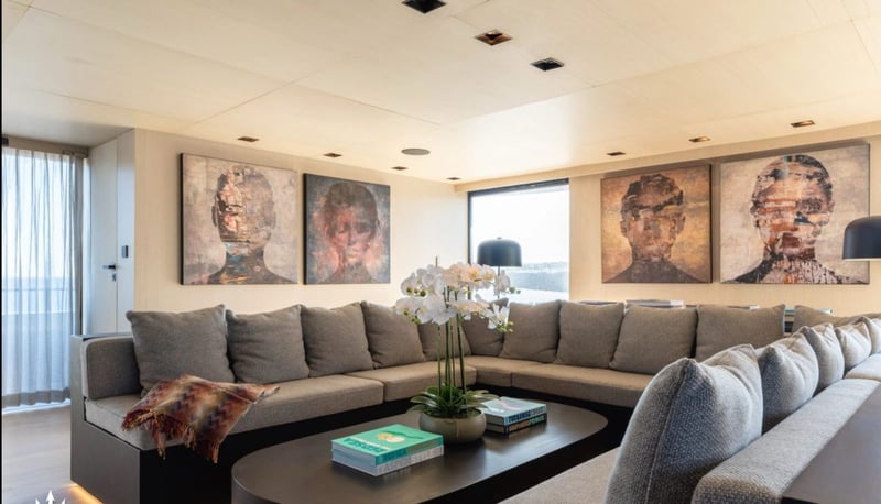 Main salon seating with artwork and coffee table