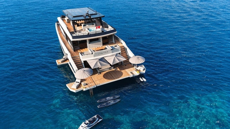 Aerial view of the stern: beach deck, swim ladder, sun deck spa and water toys